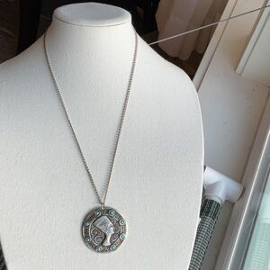 Nefertiti this necklace has aqua blue stones. I’m not sure it’s silver metal